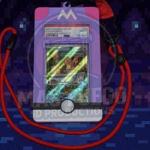 May include: A purple card holder with a red lanyard, displaying a Pok&eacute;mon trading card. The card features a Charmander illustration and text. The holder has a white button and the text "MA FGO 3D PRODUCTIONS".