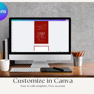 May include: A desktop computer displays a red graphic with the text "THE PERFECT MATCH" and an illustration of Cupid. The image is on a wooden desk with a keyboard, a white mug, and a pencil holder. The Canva logo is in the upper left corner.