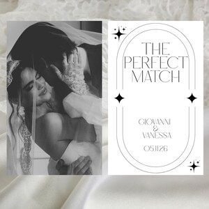 May include: Black and white wedding photo with a couple embracing under a veil. The right side features text: "THE PERFECT MATCH" with names "Giovanni & Vanessa" and the date "05.11.26" in a minimalist design.