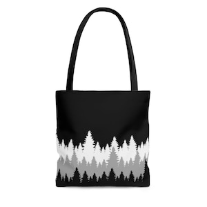 Black canvas tote bag with nature print design, black and white forest