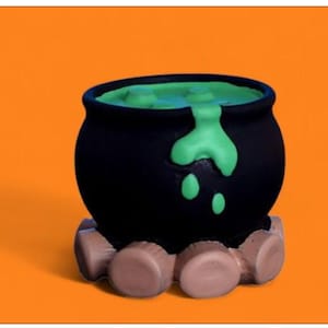 May include: A black cauldron with green liquid overflowing, set on a brown base. The cauldron is a Halloween decoration, with a bright orange background.