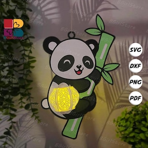 May include: A panda bear holding bamboo and a glowing lantern. The panda is black and white with a red mouth. The lantern is yellow and has a decorative pattern. The image includes the text "SVG", "DXF", "PNG", and "PDF".