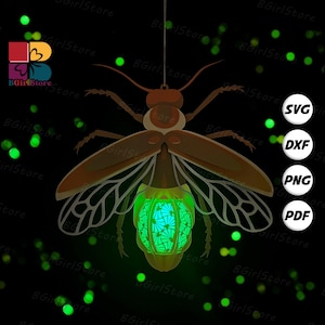 May include: A brown and green laser-cut firefly design, suspended by a string. The firefly has detailed wings and a glowing green abdomen. The image includes the text "SVG, DXF, PNG, PDF" and the logo "BGirlStore".