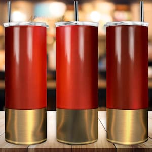 May include: Three stainless steel tumblers with a red and gold design. The tumblers have a red body with a gold band around the bottom.