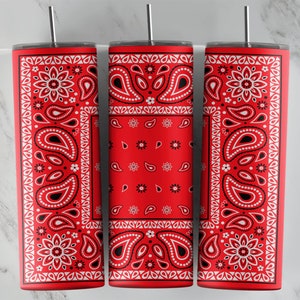 May include: Three red and white patterned stainless steel tumblers with lids and straws. The pattern is a traditional bandana design.