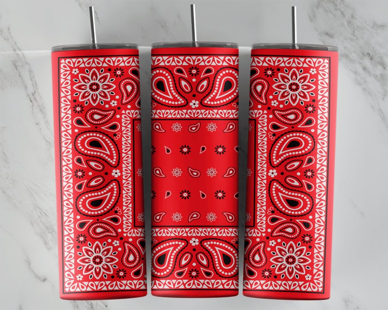 May include: Three red and white patterned stainless steel tumblers with lids and straws. The pattern is a traditional bandana design.