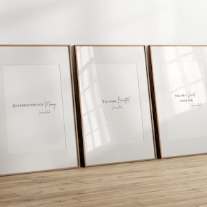 May include: Three framed prints with white backgrounds and black text. The prints feature quotes from the song "You Were Beautiful" by James Blunt. The quotes are "Anything for our money", "You were beautiful", and "Tell me a secret, a nice one."