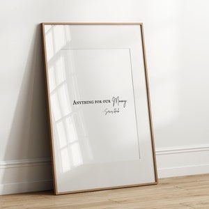 May include: A framed print with a white background and black text that reads "Anything for our Money -  Simon & Schuster".