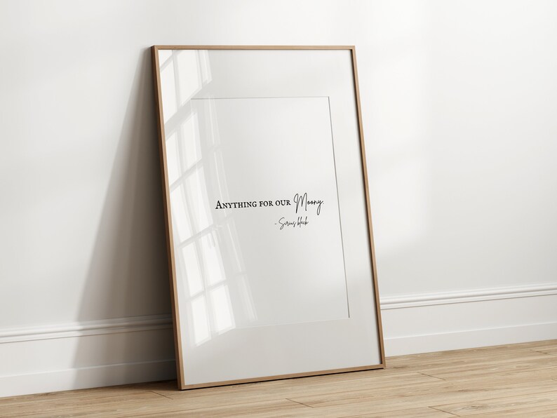 May include: A framed print with a white background and black text that reads "Anything for our Money -  Simon & Schuster".