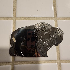 German silver broach with a Buffalo design