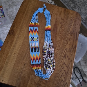 Loom Beaded Necklace with an eagle feather and medicine wheel design