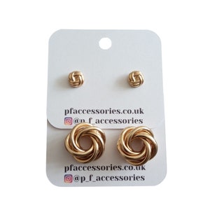 May include: A set of three gold knot-shaped stud earrings. The earrings are displayed on a white card with the text "pfaccessories.co.uk" and "@p_f_accessories".