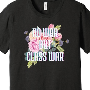 May include: Black t-shirt with a floral design and the text "No War But Class War" in a glitchy font.