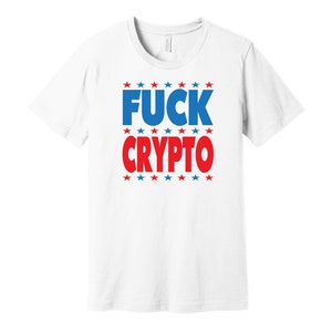 May include: White t-shirt with the text "FUCK CRYPTO" in blue and red letters, surrounded by red and blue stars.