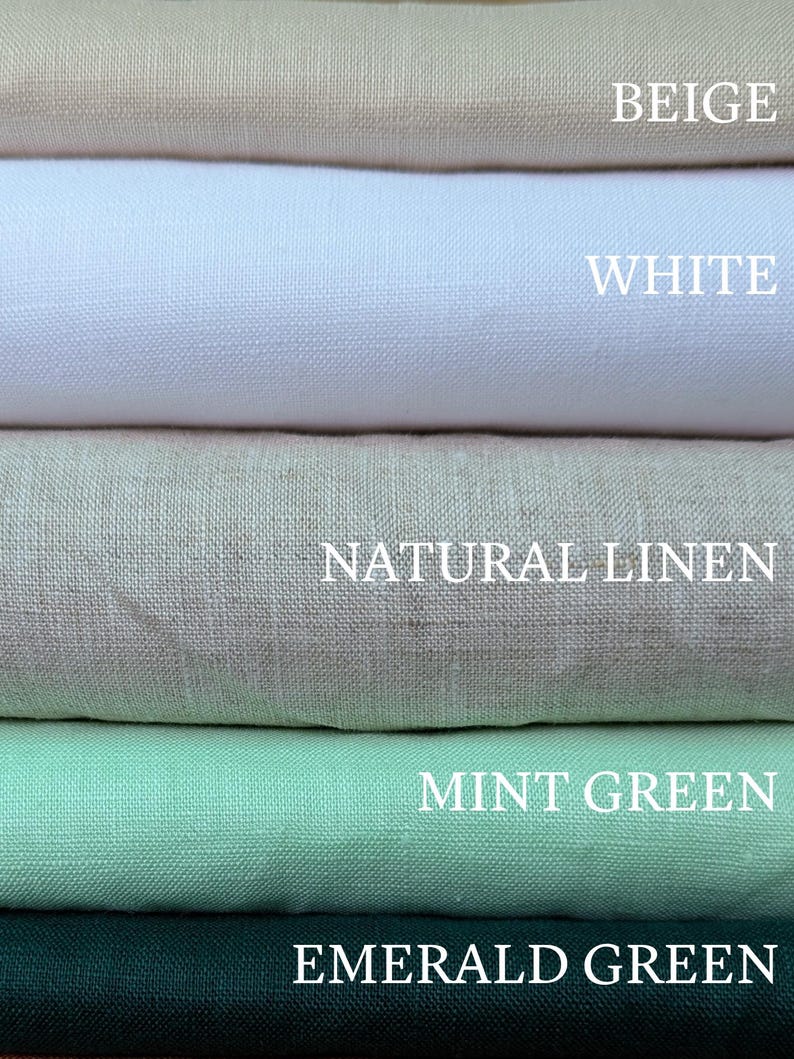 May include: A stack of five folded fabric swatches in beige, white, natural linen, mint green, and emerald green. Each color is labeled with its corresponding name in white text, clearly visible on the surface of each respective fabric layer.
