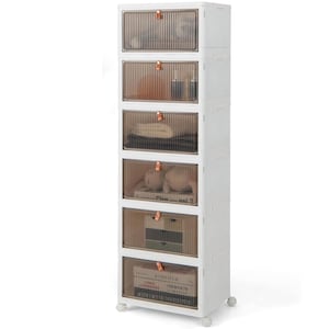 May include: White 5-drawer storage unit with clear plastic drawers and brown trim. Each drawer has a small copper handle. The unit is on wheels.