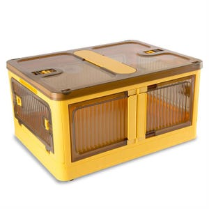 May include: A yellow plastic storage container with a clear lid. The container has two compartments and a handle on the top.