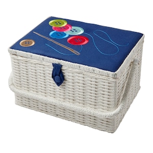 May include: White wicker sewing box with a blue lid featuring an embroidered design of colourful buttons and thread.