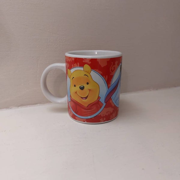 Vintage Winnie the Pooh Tigger and Eyore Mug for children.