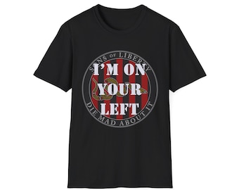 May include: Black t-shirt with a white circle graphic that says "Sons of Liberty I'm on your left Die mad about it" with a snake and red and white stripes.