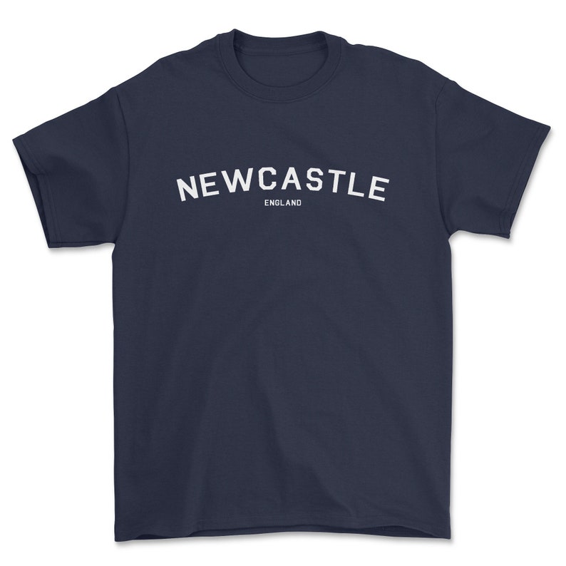 May include: A navy blue t-shirt with white text that reads "NEWCASTLE ENGLAND".