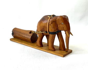 Hand-Carved Folk Art Wooden Elephant Sculpture Featured with Saddle Harness and Pulling a Log with Metal Chains