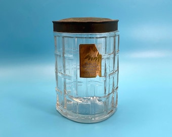 Tarro de cristal con diseño de cesta para pastillas de baño Cheramy April Showers de estilo vintage.