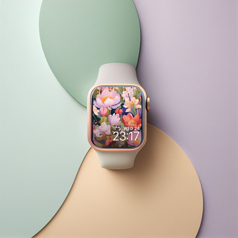 May include: A white and rose gold Apple Watch with a floral watch face that reads "WED 24 23:17".