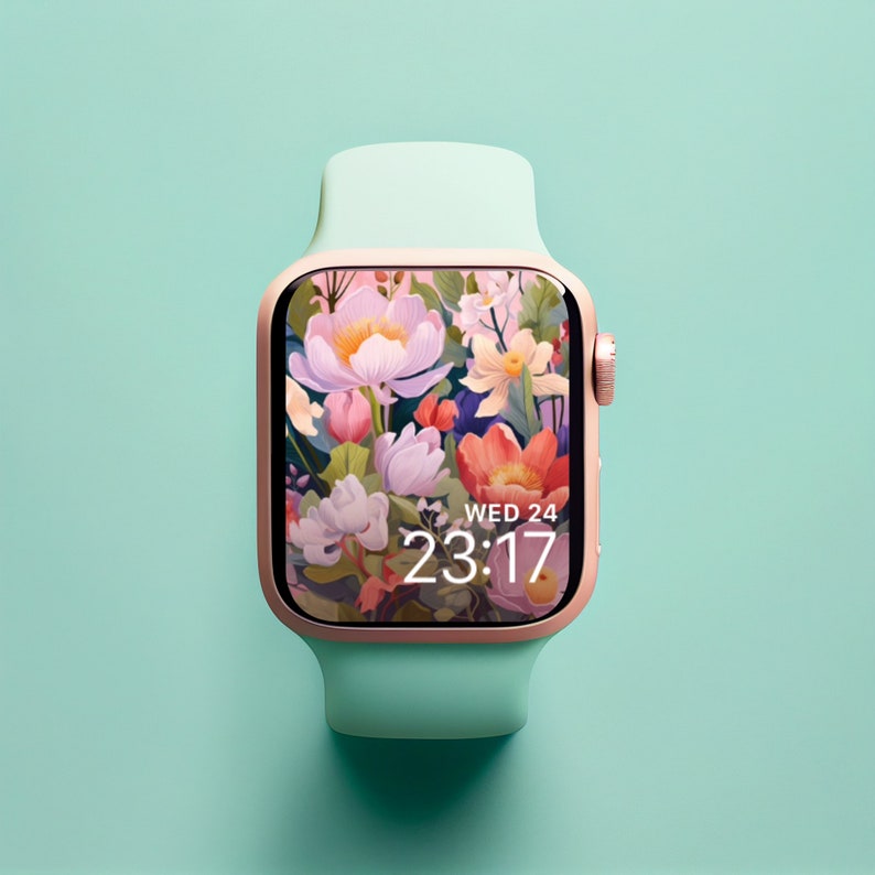 May include: A rose gold smartwatch with a mint green band. The watch face displays a floral pattern with a digital clock that reads "WED 24 23:17".