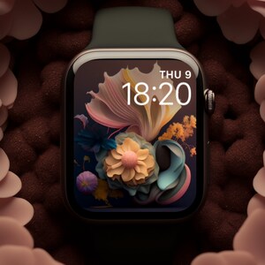 May include: A black smartwatch with a green band displays the time 18:20 and the date THU 9 on a dark background with a floral design.