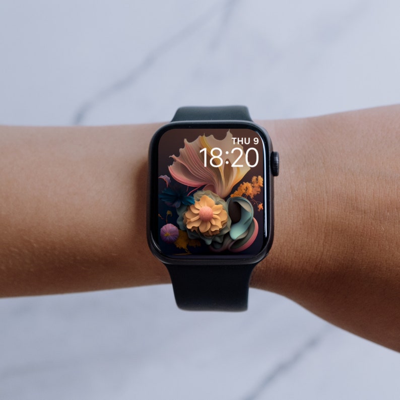 May include: A black Apple Watch with a floral watch face that reads "THU 9 18:20" on a person's wrist.