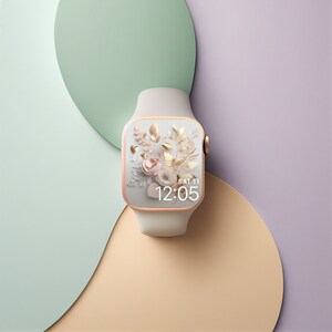 May include: A white smartwatch with a rose gold band and a floral watch face. The watch face displays the time as 12:05 and the date as SAT 11.