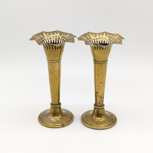 Antique English brass vases with classic Victorian charm, beautifully crafted with closed bases and a rich aged patina, a rare elegant pair.