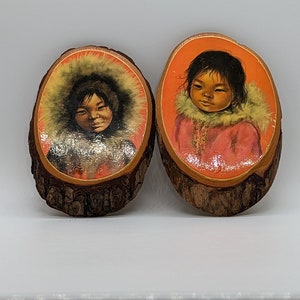Vintage Inuit-kinderafdrukken op houten ronden