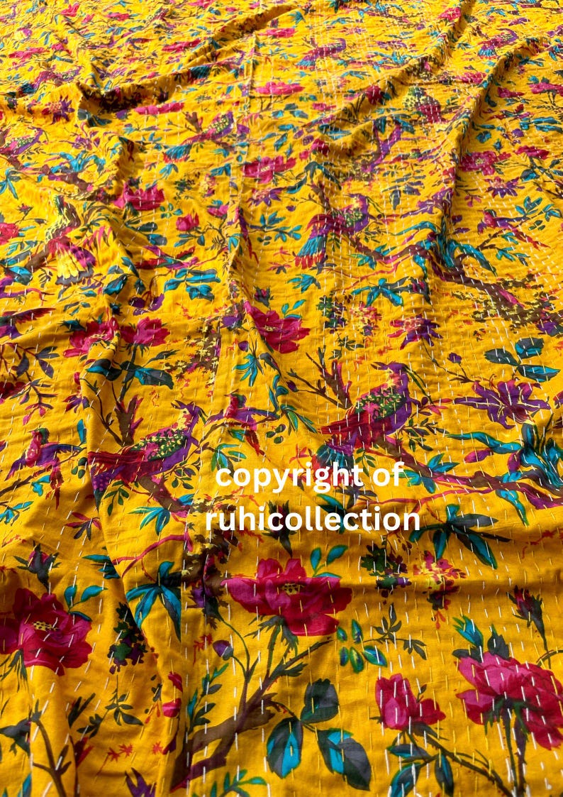 May include: Yellow fabric with a floral and bird pattern in shades of pink, purple, and teal. The fabric has a stitched design and the text "copyright of ruhicollection".