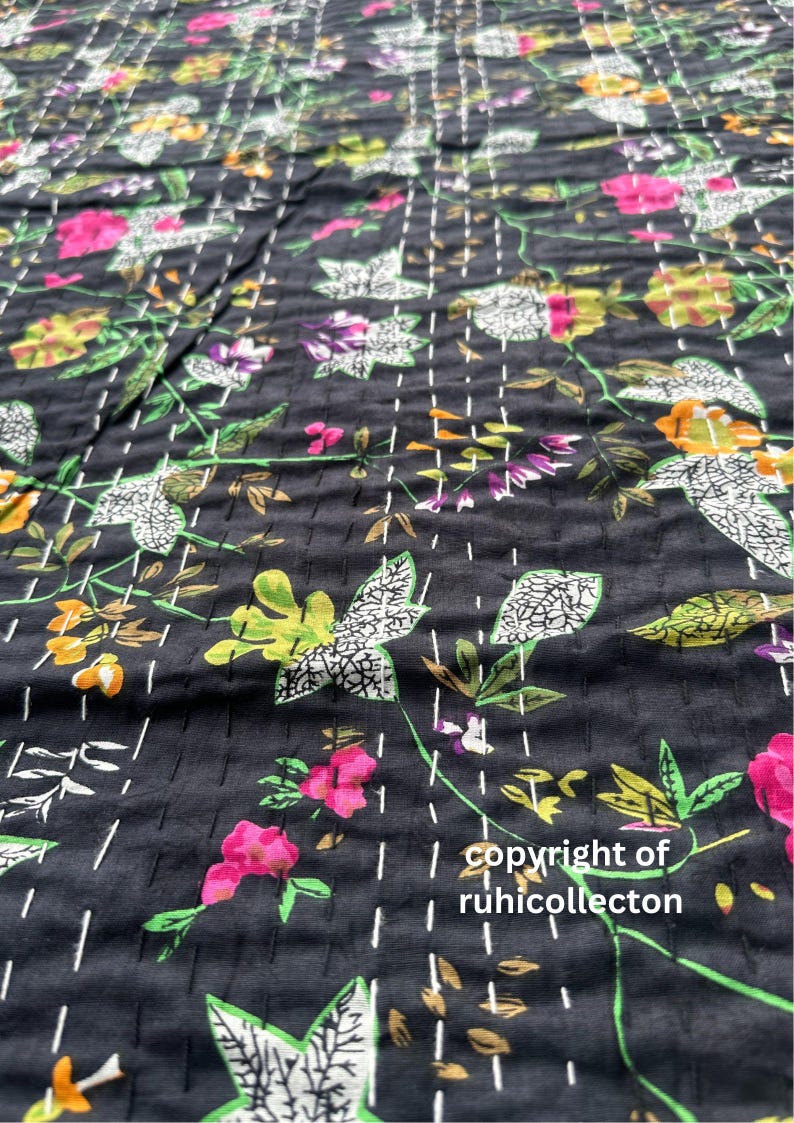 May include: Black fabric with a floral pattern in shades of pink, green, white, and yellow. The fabric is quilted with white stitching. The text "copyright of ruhicollector" is visible in the bottom right corner.