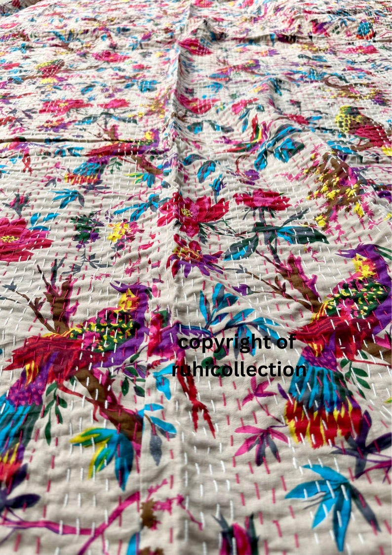 May include: Beige textile with a vibrant floral and bird pattern. The design features colorful birds, flowers, and leaves in shades of pink, blue, purple, and yellow. The text "copyright of rahicollection" is visible.
