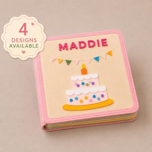 May include: A square photo album with a pink border and a beige cover featuring the name MADDIE in pink letters, a colorful felt bunting, and a two-tiered birthday cake with a candle. A scalloped badge states 4 DESIGNS AVAILABLE.