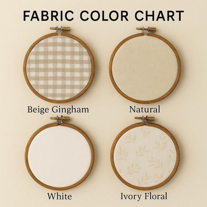 May include: Fabric color chart featuring four embroidery hoops. The hoops have wooden frames and hold different fabric samples: beige gingham, natural, white, and ivory floral. The text "FABRIC COLOR CHART" is at the top.