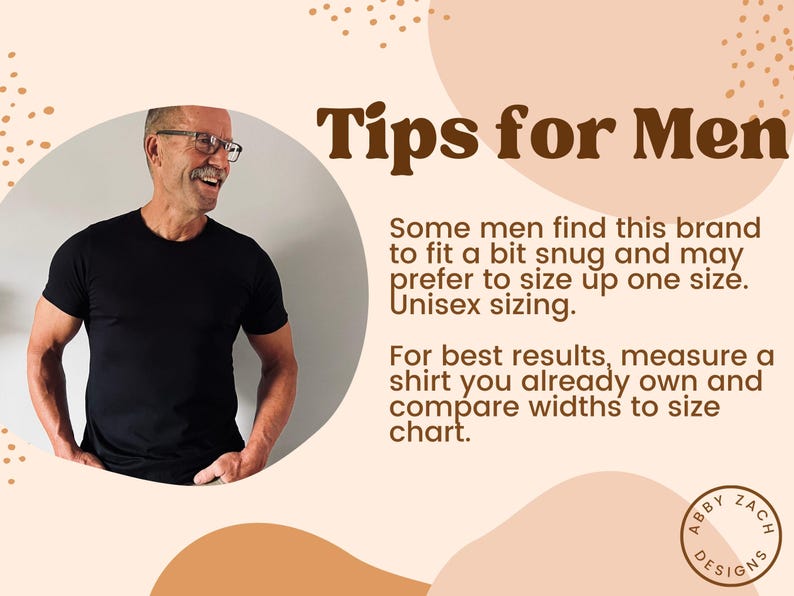 May include: Tips for men on sizing for a black t-shirt. The text reads "Some men find this brand to fit a bit snug and may prefer to size up one size. Unisex sizing. For best results, measure a shirt you already own and compare widths to size chart."