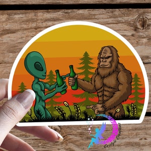 Sasquatch Drinking with Alien Sticker - High Quality Waterproof Weatherproof Vinyl Sticker! Available in Multiple Sizes! Bigfoot, Aliens