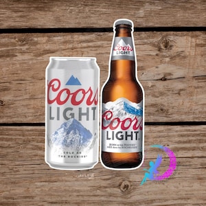 May include: A can and bottle of Coors Light beer. The can is silver with red and blue text and a mountain graphic. The bottle is brown with a white label and mountain graphic. The text on the bottle reads "Born in the Rockies".