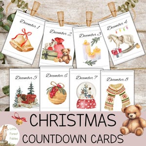 Könnte beinhalten: Acht Weihnachtskarten zum Countdown, jede mit einer Aquarellillustration, hängen mit Holzklammern an einer Schnur. Die Karten zeigen festliche Bilder wie Glocken, Geschenke, Kerzen, ein Schaukelpferd, einen Schlitten, eine Schneekugel und einen Schal. Die Worte "Christmas Countdown Cards" sind zu sehen.