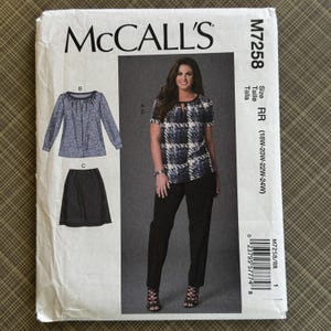 May include: McCall's M7258 sewing pattern. The pattern includes designs for a top, skirt, and pants. The size is RR (18W-20W-22W-24W). The front of the pattern features a woman wearing the designed clothing.