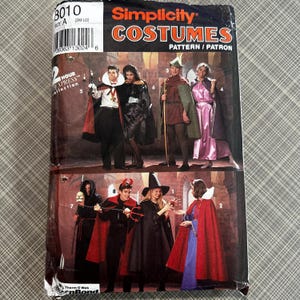 May include: Simplicity pattern 3010 for costumes. The pattern includes instructions for making a vampire, a witch, a devil, a princess, a fairy, and a medieval knight. The pattern is for sizes small to large.