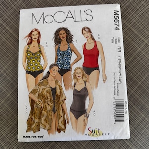 May include: A McCall's sewing pattern for swimwear, featuring illustrations of various swimsuit styles. The pattern includes sizes RR (18W-20W-22W-24W). The cover displays images of women in different swimsuit designs, including a halter top and a one-piece suit.