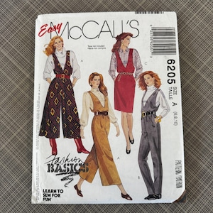 May include: A vintage McCall's sewing pattern titled "Easy McCall's" featuring illustrations of women's fashion designs. The pattern includes images of jumpsuits and a dress. The cover has the text "Fashion Basics" and "Learn to Sew for Fun".