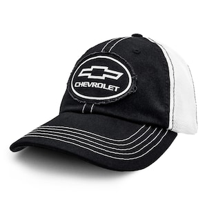 May include: A black baseball cap with a white mesh back and a distressed oval patch on the front. The patch features the white Chevrolet bowtie logo and the text CHEVROLET. The cap includes white contrast stitching along the brim and crown.