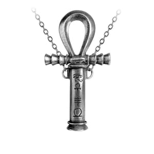 May include: A silver-toned metal ankh pendant necklace featuring a cylindrical base engraved with four distinct Egyptian-style symbols. The pendant is suspended from a delicate silver-colored chain, showcasing a weathered, antiqued finish.