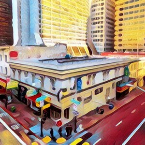 Op de afbeelding: Een kleurrijk, abstract schilderij van een stadsscène met gebouwen, auto's en voetgangers. De gebouwen zijn geschilderd in een verscheidenheid aan felle kleuren, waaronder geel, oranje, rood en blauw. De auto's zijn geschilderd in verschillende tinten grijs en zwart. De voetgangers zijn geschilderd in verschillende kleuren, waaronder wit, zwart en bruin.